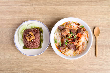 Northern Thai food (Kanom Jeen Nam Ngeaw), Rice noodles spicy soup with pork blood and steamed rice mixed with pork blood (Khao Kan Chin)の写真素材