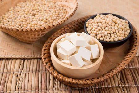 Fresh cube tofu and soybean seeds in a bowl prepare for cooking, Asian vegan foodの写真素材