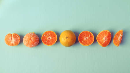 Fresh tangerine orange fruit on vintage color backgroundの写真素材