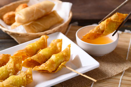 Asian deep fried crispy wonton stuffed with minced pork, quail egg and shrimp dipping with chili...