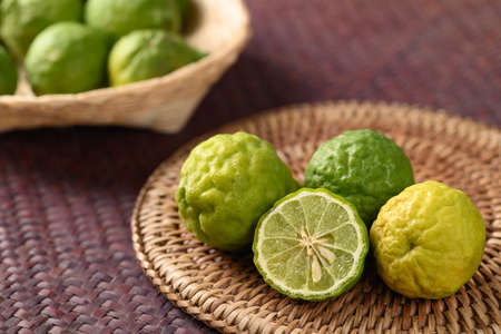 Fresh bergamot fruit on woven rattan plate, Food ingredients and extract used for medicine, tea,...