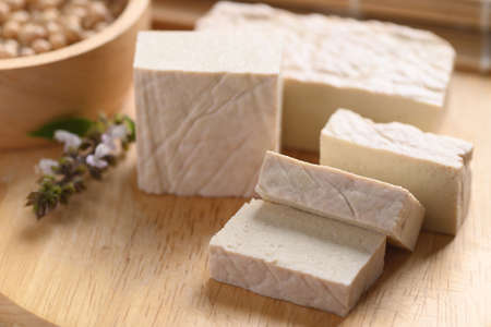 Fresh Tofu on wooden cutting board, Food ingredient in Asian cuisineの写真素材