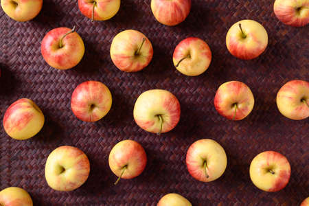 Fresh red apple fruit on red background, Flat layの写真素材