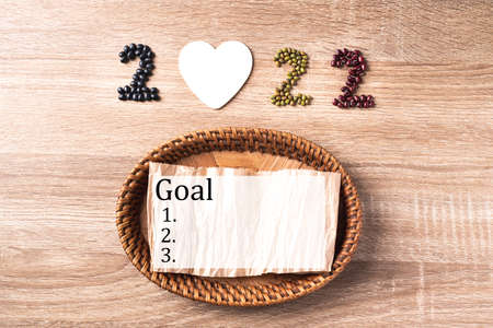 2022 new year made from bean seed (black soybean, mung bean and azuki bean) with white heart shape...