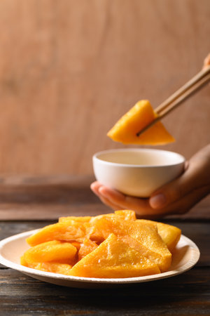 Deep fried Burmese tofu eating with spicy dipping sauce, Tai Yai food in Northern of Thailandの写真素材