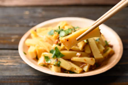 Spicy fresh Burmese tofu salad on wooden table, Tai Yai food in Northern of Thailand