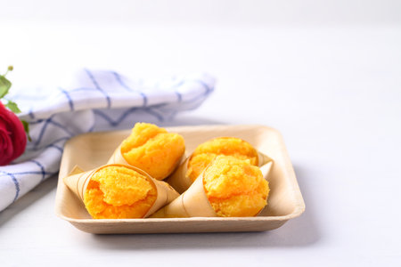 Homemade Toddy palm cake on natural plate with white background, Thai traditional dessert