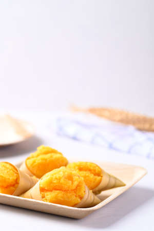Homemade Toddy palm cake on natural plate with white background, Thai traditional dessert