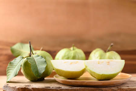 Fresh organic guava fruit on wooden background, Tropical fruit