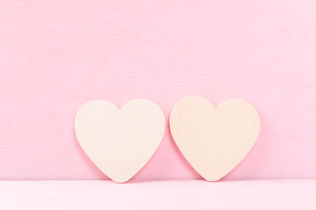 White couple heart shape on pink background, Valentine's day concept