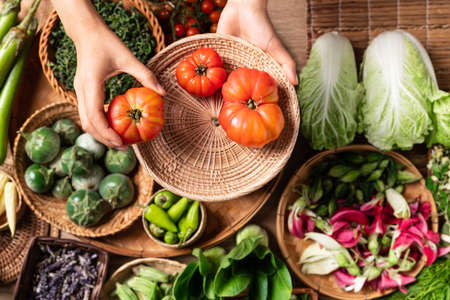Fresh organic Southeast Asian vegetables and edible flowers from local farmer market, Northern of...