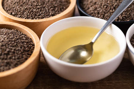 Perilla oil and seeds in bowl, Healthy herbal seed ingredients in Asian foodの写真素材