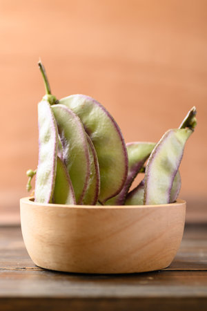 Asian Hyacinth bean in bowl on wooden background
