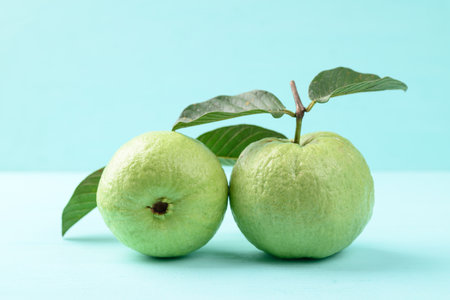 Fresh Guava fruit with leaf on color background, Tropical high vitamin C fruitの写真素材