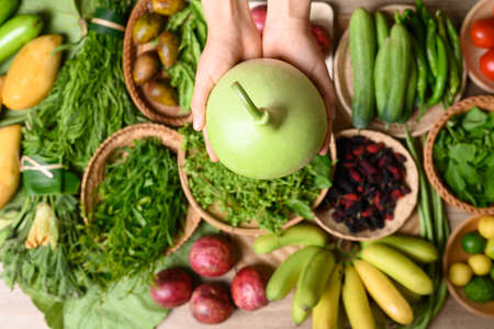 Organic Southeast Asian vegetables and fruits from local farmer market in summer season, Northern of Thailand, Sustainability concept, Table top viewの写真素材