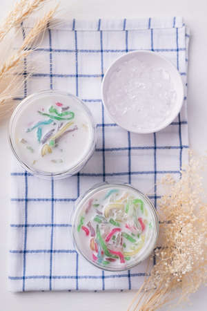 Thai dessert (Lod Chong), Colorful rice flour jelly with coconut milk in glass and ice, Top viewの写真素材