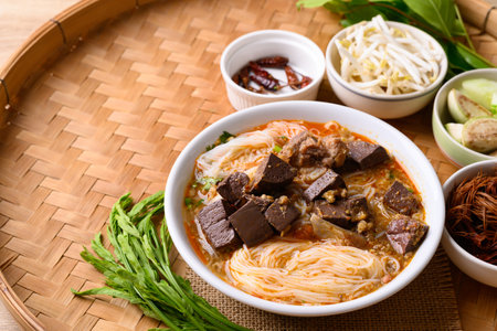 Northern Thai food, Spicy rice noodles soup with pork eating with fresh vegetables, Local Thai foodの写真素材