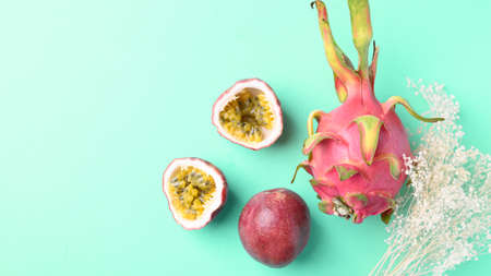 Dragon fruit and passion fruit on pastel color background with copy space, Tropical fruit in summer seasonの写真素材