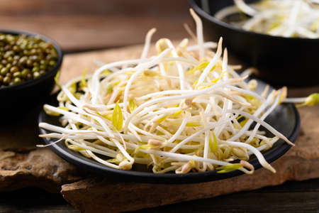 Mung bean sprout on wooden background, Asian food ingredientsの写真素材