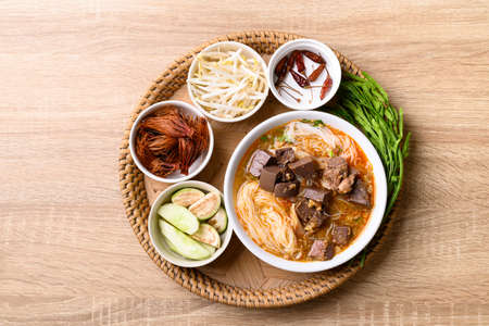 Northern Thai food, Spicy rice noodles soup with pork eating with fresh vegetables, Local Thai foodの写真素材