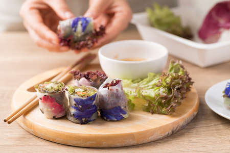 Fresh spring roll with flower and vegetable, Vegan food cookingの写真素材