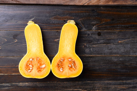 Butternut squash or butternut pumpkin on wooden background, Table top view with copy spaceの写真素材