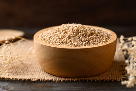 Brown quinoa seed in wooden bowl, Super foodの写真素材