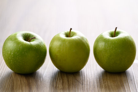 Green apple fruit on wooden background, Healthy fruitの写真素材