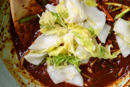 Korean food, Kimchi cabbage cooking in bowl, Homemade fermented side dishの写真素材