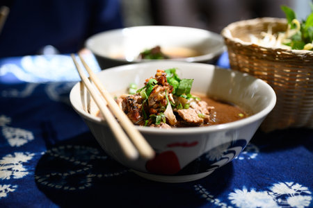 Rice noodles soup with pork and vegetables, Thai boat noodles style