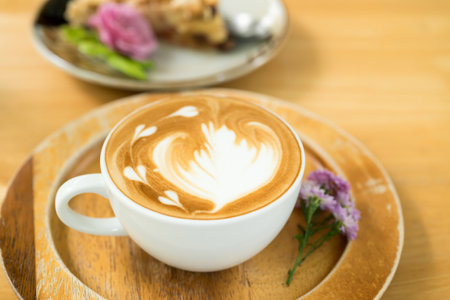 Latte art coffee on wooden background, Hot drink