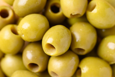 Pickled olives, Pitted green olives texture backgroundの写真素材