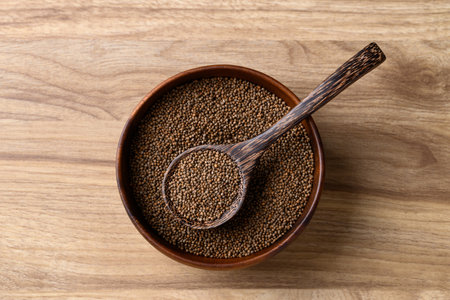 Perilla seed in bowl with spoon on wooden background, Healthy herbal seed ingredients in Asian food,...