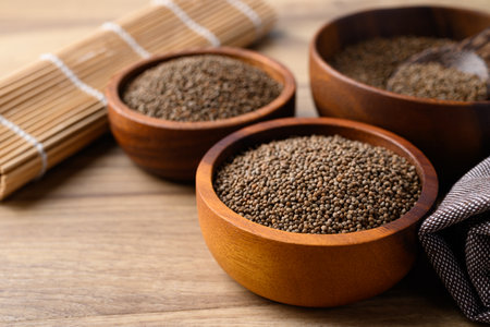 Perilla seed in wooden bowl, Healthy herbal seed ingredients in Asian foodの写真素材