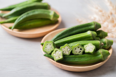 Green okra in wooden bowl prepare for cooking, Organic vegetablesの写真素材