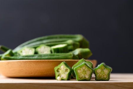 Green okra in wooden bowl prepare for cooking, Organic vegetablesの写真素材