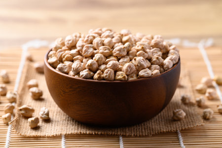 Organic dried chickpea in wooden bowl, Healthy food ingredientの写真素材