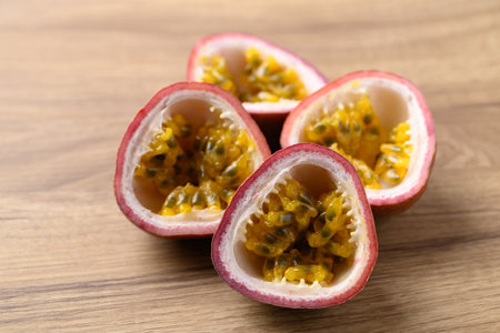 Half passion fruit on wooden background, Healthy eatingの写真素材