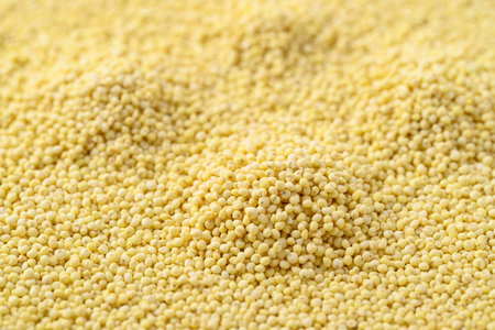 Organic yellow millet grain texture background, Healthy food ingredientの写真素材