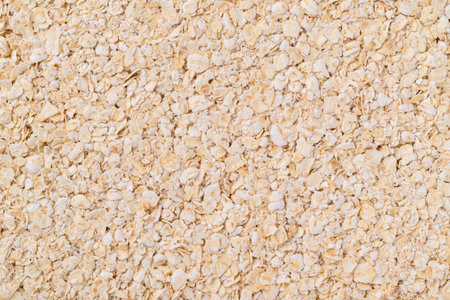 Oat flakes texture background, Food ingredient in oatmeal, muesli or porridgeの写真素材