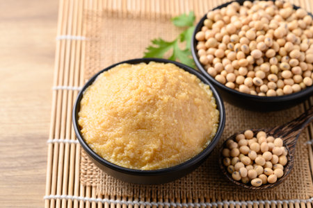Miso paste in black bowl, Japanese seasoning made from fermenting soybeans with salt, Traditional food ingredient in Japanese cuisineの写真素材