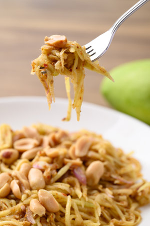 Spicy mango salad ready to eat, Thai foodの写真素材