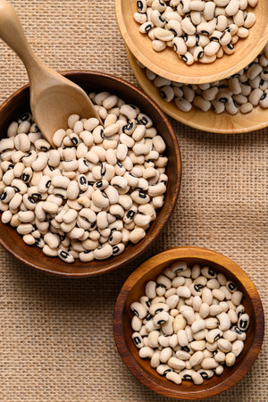 Black-eyed pea or cowpea in wooden bowl with scoop, Food ingredient