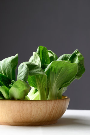 Organic Bok choy or Pak choi in wooden bowl, Fresh vegetable, Food ingredientの写真素材