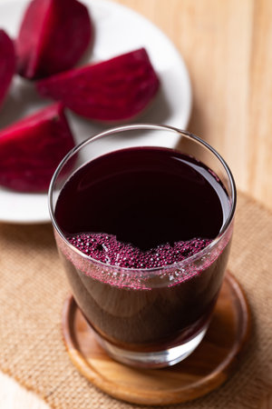 Fresh beetroot juice in glass on wooden board, Healthy drinkの写真素材