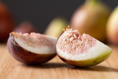 Fresh sliced fig on cutting wooden board, Autumn fruit