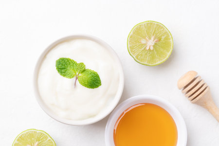 Yogurt, lime and honey on white backgroundの写真素材