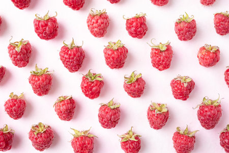 Flat lay of fresh ripe raspberry with leaf on pink background, Summer fruit, Top view