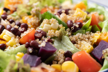 Healthy vegetable salad with lettuce, quinoa seed, azuki bean, corn, tomato, pumpkin and purple sweet potato. Vegan and plant-based foodの写真素材