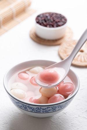 Tangyuan (Chinese sweet dumpling), Glutinous rice ball in syrup, Dessert celebrated in mid autumn lantern festival or new yearの写真素材